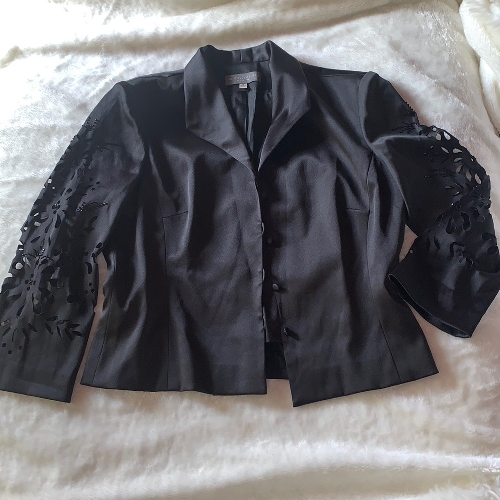 blazer with laser cut floral  design on the sleeves